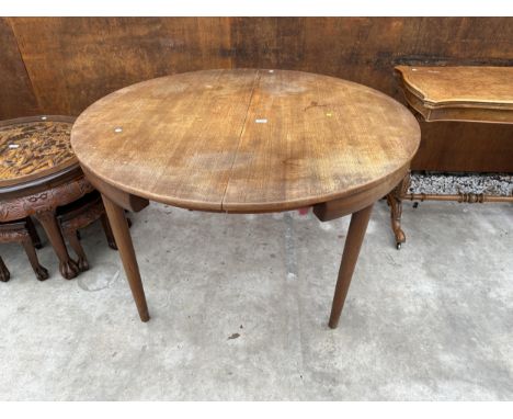 A RETRO DANISH TEAK EXTENDING DINING TABLE (LEAF 20") BEARING THE LABEL FURNITURE MAKERS DANISH CONTROL AND STAMPED MADE IN D