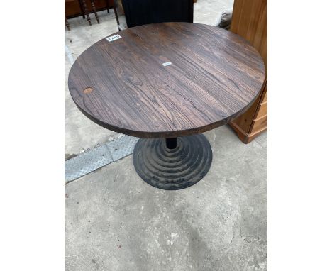 A PUB TABLE ON A STEPPED METALWARE BASE 36" DIAMETER 