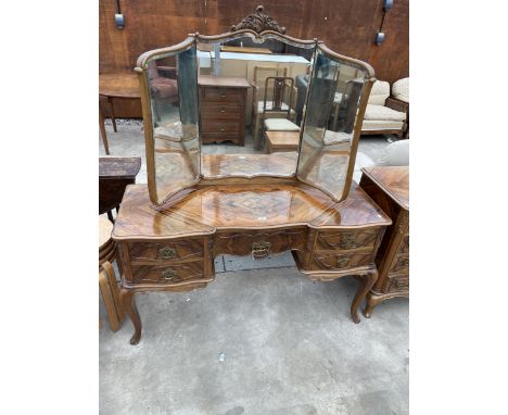 A CONTINENTAL WALNUT DRESSING TABLE WITH TRIPLE MIRROR, BRASS HANDLES AND APPLIED DECORATION 53" WIDE 