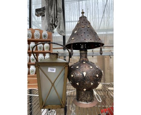 A DECORATIVE TABLE LAMP AND A LANTERN 