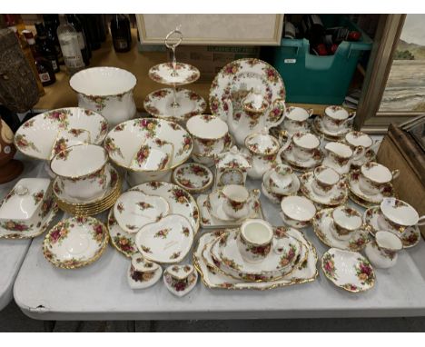 A VERY LARGE COLLECTION OF ROYAL ALBERT OLD COUNTRY ROSES TO INCLUDE TRIOS, JUGS, SUGAR BOWLS, COFFEE POT, TEAPOT, CAKE STAND