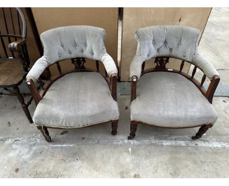 A PAIR OF LATE VICTORIAN BUTTON BACK TUB CHAIRS ON TURNED LEGS AND SUPPORTS WITH K &amp; G CASTERS 