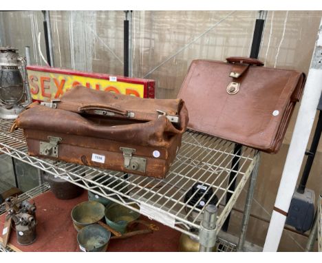 A VINTAGE LEATHER DOCTORS BAG AND A FURTHER VINTAGE LEATHER BRIEFCASE 