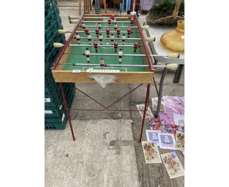 A SMALL VINTAGE FOLDING TABLE FOOTBALL GAME 