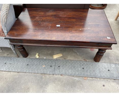 A METAL BANDED HARDWOOD COFFEE TABLE - 43" X 23" 