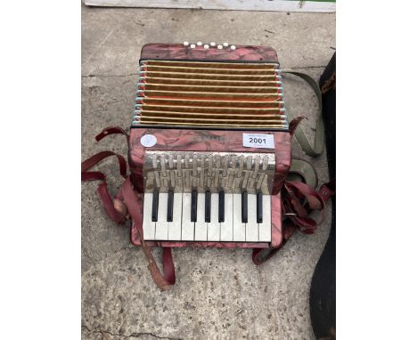 A SMALL HOHNER ACCORDIAN 