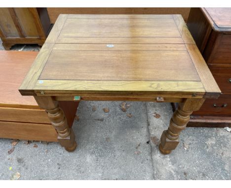 A MID 20TH CENTURY OAK FOLD OVER WORK/DINNER TABLE 