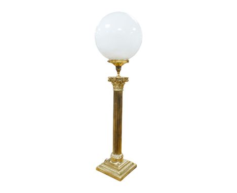 A tall brass Corinthian column table lamp with spherical glass shade, 84cm high including glass shade. Condition - good, bras