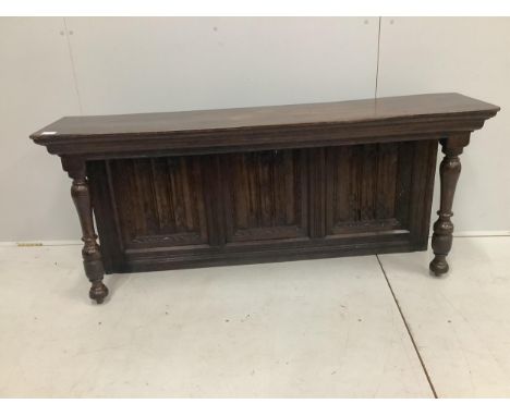 A section of linen fold panelling mounted as a sideboard back, width 165cm, height 65cm. Condition - good