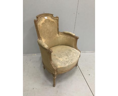 A Louis XV style carved giltwood and composition fauteuil, width 66cm, depth 52cm, height 90cm. Condition - fair