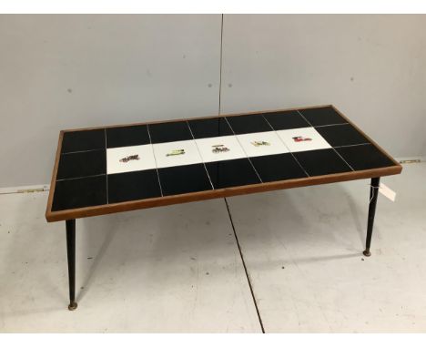 A 1960s tile top coffee table, width 110cm, depth 48cm, height 51cm. Condition - fair to good