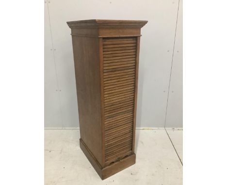 An early 20th century oak Lebus tambour filing cabinet, width 37cm, depth 49cm, height 116cm. Condition - poor to fair