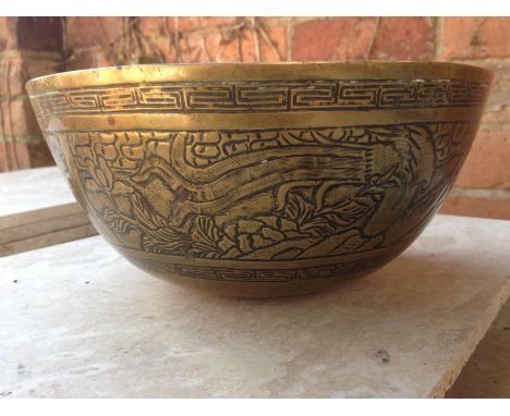 Oriental bronze bowl depicting Dragons with 6 character marks in relief on base - 25cm diameter