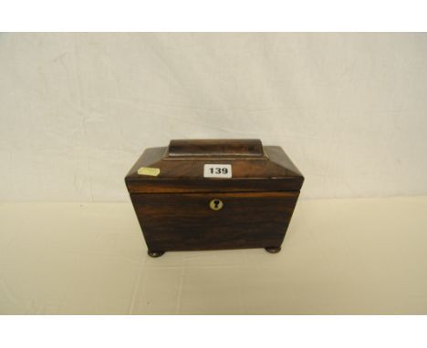 Small 19th century rosewood tea caddy standing on bun feet with ivory escutcheon 