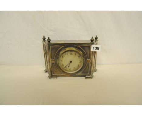 Superb 1920s silver on copper shelf clock by Pearce of Leicester standing on 4 feet and decorated with flowers, beading and 4