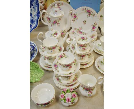 Royal Albert Moss Rose pattern tea service,  comprising tea pot and coffee pot with six cups and saucers, tea plates, dinner 