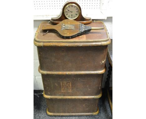 An early 20th century trunk; a pair of fire bellows; a mantel clock.
