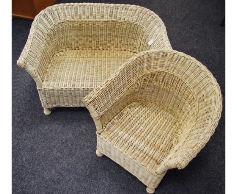 A children's wicker two seater sofa and conforming chair