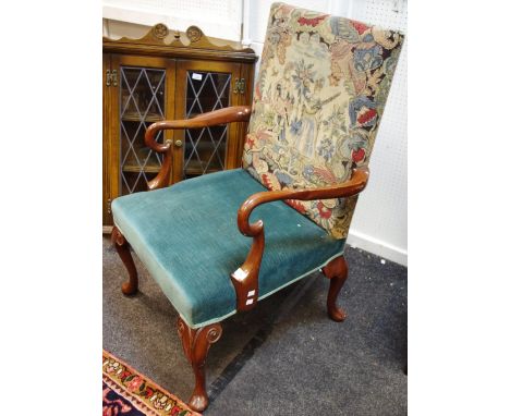 A George I style open armchair with tapestry upholstered back, shaped arms, cabriole legs.