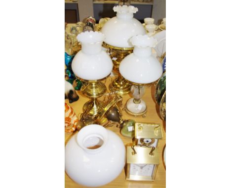 A brass electric oil lamp, with white shade; another smaller; an alabaster &amp; brass baluster shaped lamp with white glass 