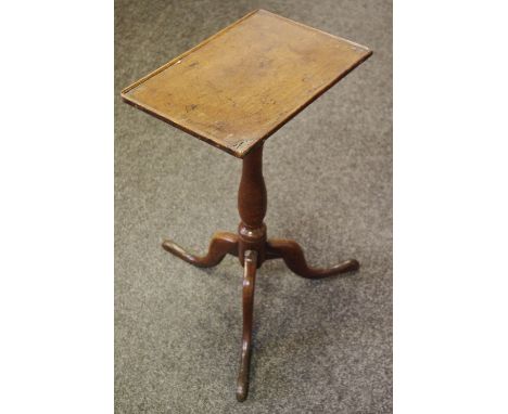 A George III oak lamp table, rectangular top, turned column, three cabriole legs.