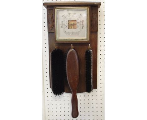 Boxes and Objects - an Art Deco carved oak hall aneroid barometer, silvered square scale, above three suspended brushes, 40cm