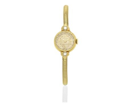 Rolex. A lady's 18K gold and diamond set manual wind cocktail bracelet watchModel: PrecisionReference: 8391Date: Circa 1960Mo