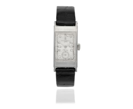Patek Philippe. A fine platinum diamond set manual wind rectangular wristwatch retailed by AspreyModel: Tegolino, Retailed by
