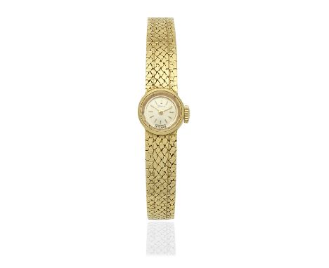 Zenith. A lady's 18K gold manual wind bracelet watchDate: Circa 1970Movement: 17-jewel manual wind, No.5125117Dial: Silvered,