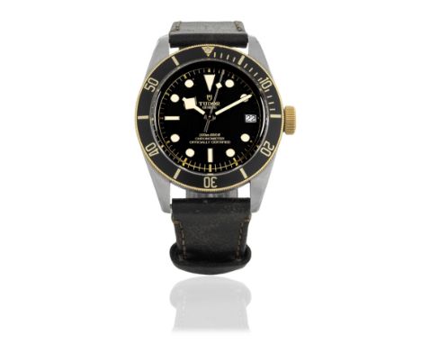 Tudor. A stainless steel and gold automatic calendar wristwatchModel: Black BayReference: 79733Date: Purchased 27th November 