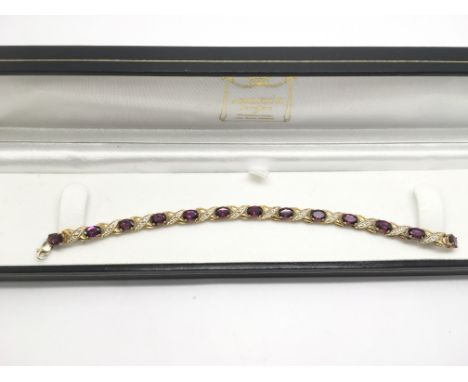 A 9ct gold line bracelet set with purple stones, possibly amethyst