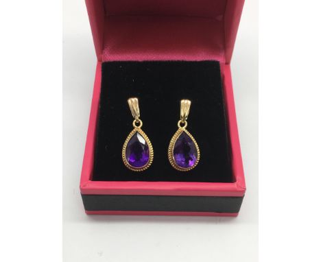 A pair of 9ct gold amethyst drop earrings