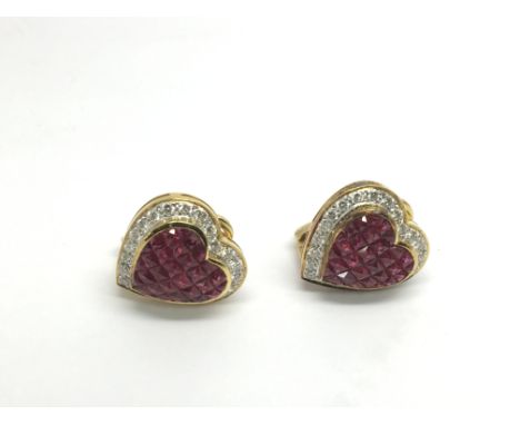 A pair of ruby and diamond heart shaped earrings, approx 13g.