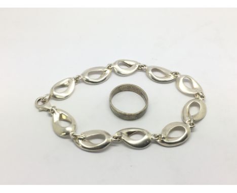 A 9ct white gold ring and a silver bracelet (2).
