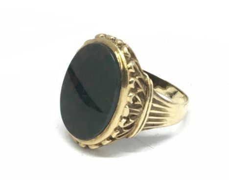 A gents 9carat gold ring set with a good size Heliotrope blood stone.