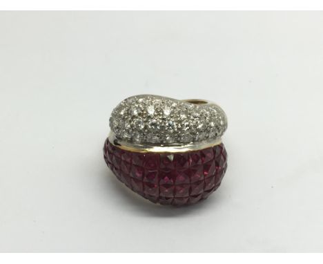 An 18ct gold, diamond and ruby modern design ring, approx 15.3g and approx size L.
