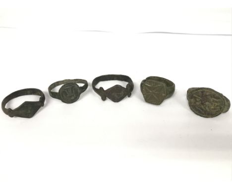 A lot of five roman rings. One looks to be A Byzantine Christian ring, and four other interesting rings as pictured.