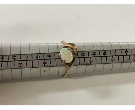 A 9ct gold and Opal mounted ring, approx 2.6g, P.5.