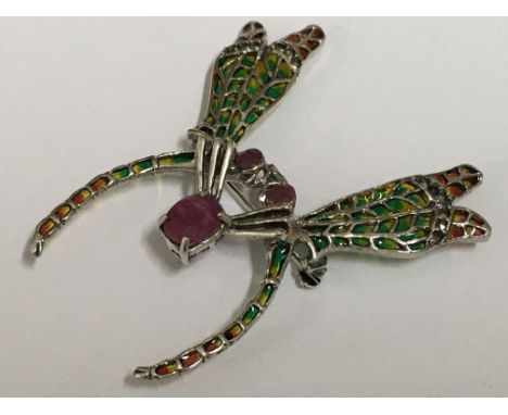 A silver plique a jour mosquitos brooch set with a large oval ruby, ruby eyes and marcasites