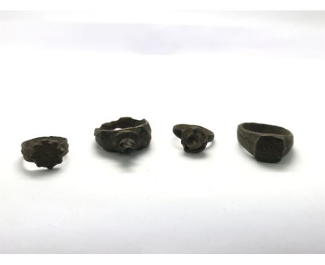 Four roman rings. One is a key ring where the key has snapped off. Three others of various designs as pictured.