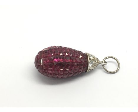 A ruby and diamond drop pendant.