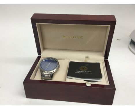 A boxed Accurist Gents watch the Celestial watch in a fitted box with paperwork. May need a new battery.
