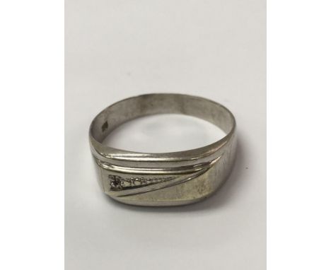 A men’s 9ct and diamond ring. Measuring approximately ring size Y. Weighing approximately 2.8g.