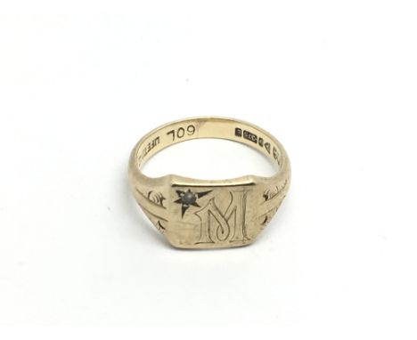 A 9ct gold signet ring set with a little diamond and engraved with the initial M, approx 2.7g and approx size I.