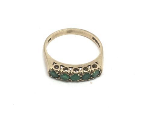 A 9ct gold ring set with five green stones, approx 2.4g and approx size M-N - NO RESERVE