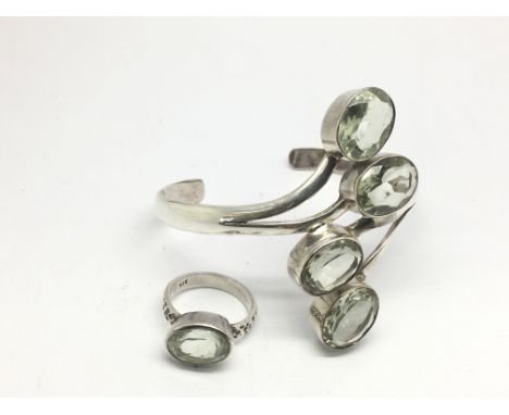 A green amethyst and silver modern design bracelet and matching ring (2).