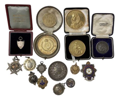 A group of silver medals, badges and medallions, including an 1886 Cardiff Science &amp; Art School town prize, a Steward's e