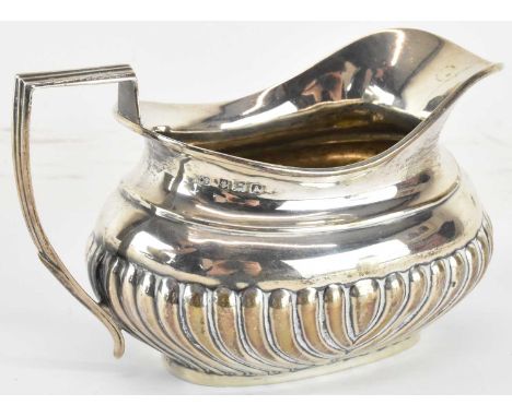WILLIAM DEVENPORT; a George V hallmarked silver milk jug, with half body fluted decoration, Birmingham 1925, height to top of