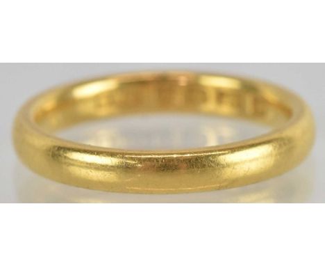 A 22ct yellow gold wedding band, size M, approx 4.8g.