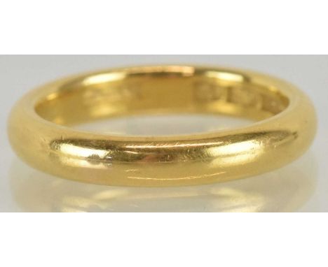A 22ct yellow gold wedding band, size K, approx 5.6g.